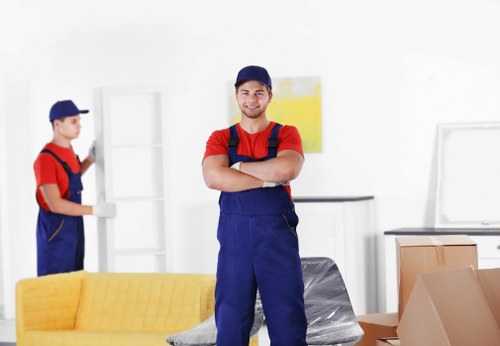Local moving team organizing furniture for transport in Walworth