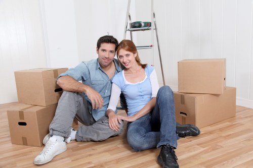 Team handling desks and equipment during an office move