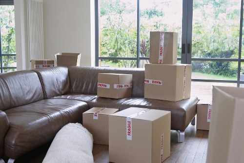 Packed moving boxes and furniture ready for removal services in Walworth